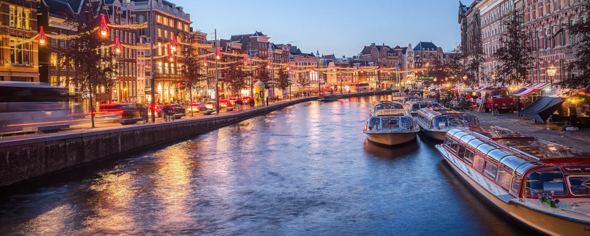 Amsterdam at dusk — one of the six regions our servers run in